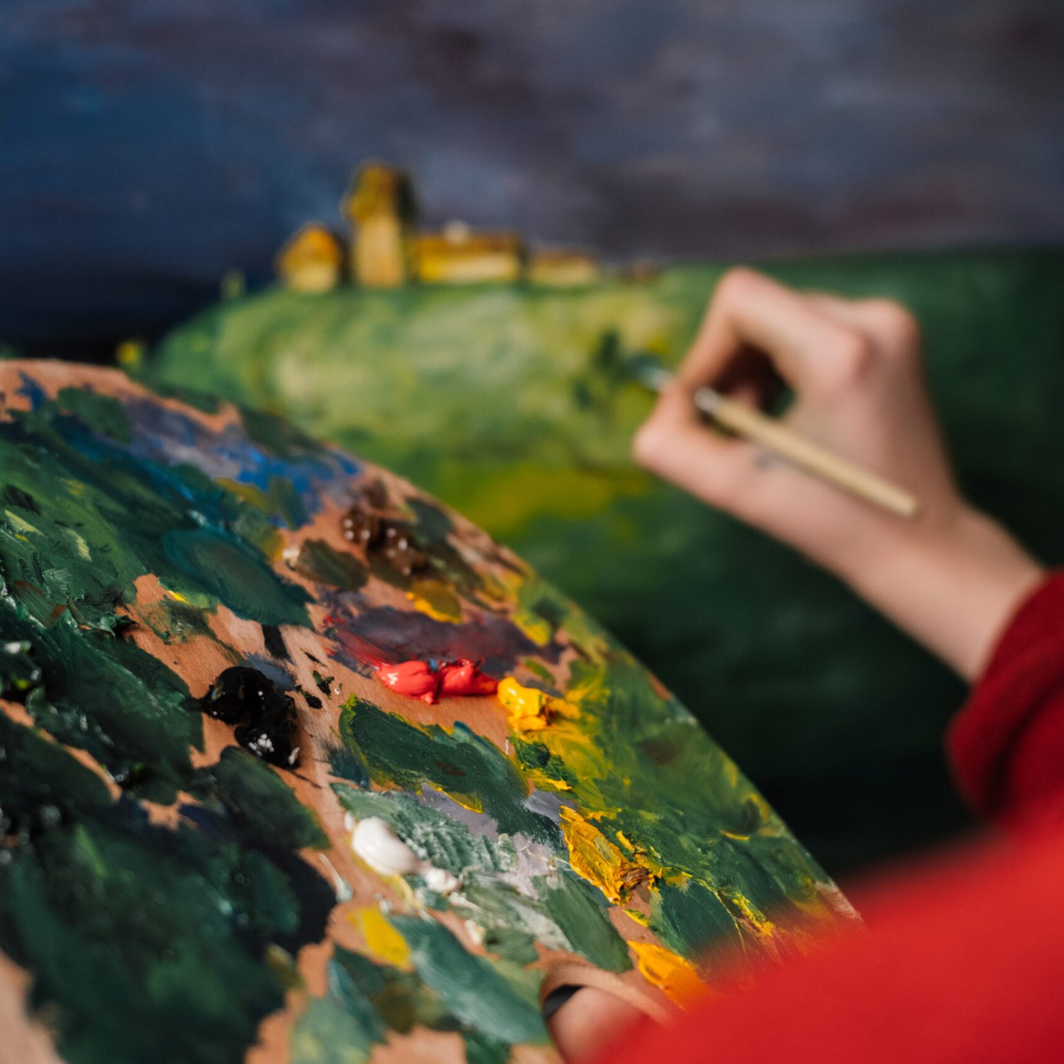 woman paints a picture with watercolor paint art. High quality photo